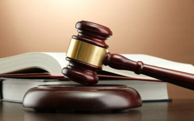 wooden gavel and books on wooden table